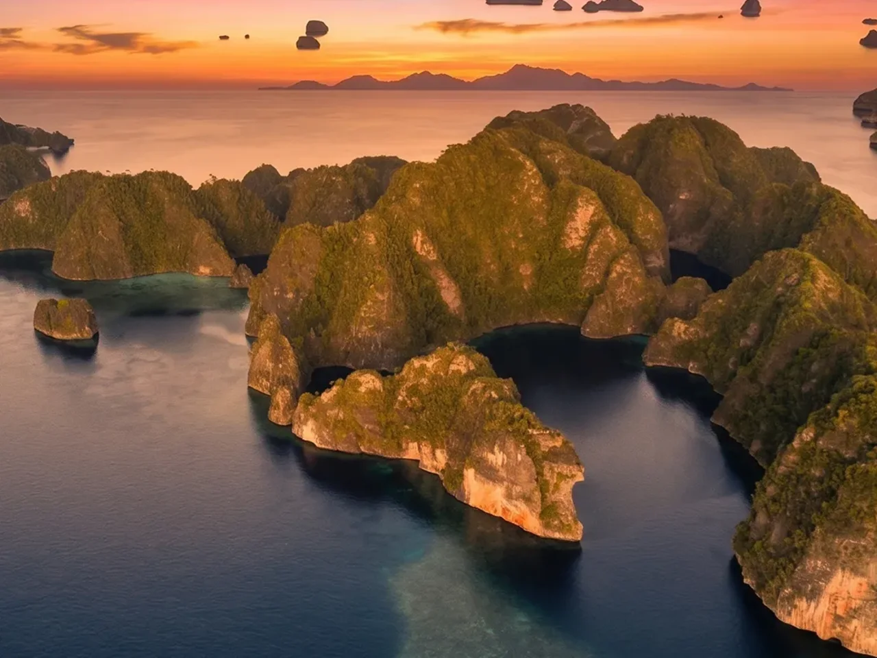 Raja Ampat, Indonesia at sunset — part of the wider Juara Holding Group travel and concierge network